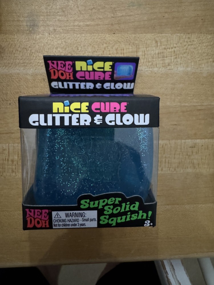 Nee Doh Glitter & Glow Blue Nice Cube in hand