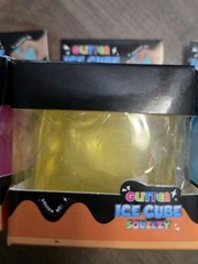 4 Glitter Ice Cube Squeezy Squishies. Blue, Yellow, Pink And Purple