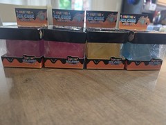 4 Glitter Ice Cube Squeezy Squishies. Blue, Yellow, Pink And Purple