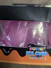 4 Glitter Ice Cube Squeezy Squishies. Blue, Yellow, Pink And Purple
