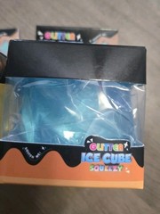 4 Glitter Ice Cube Squeezy Squishies. Blue, Yellow, Pink And Purple