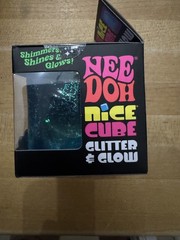 Nee Doh Glitter & Glow Blue Nice Cube in hand