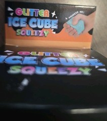 4 Glitter Ice Cube Squeezy Squishies. Blue, Yellow, Pink And Purple