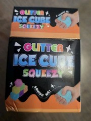 4 Glitter Ice Cube Squeezy Squishies. Blue, Yellow, Pink And Purple