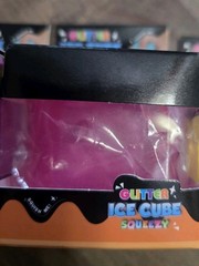4 Glitter Ice Cube Squeezy Squishies. Blue, Yellow, Pink And Purple
