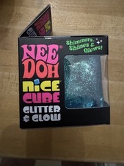 Nee Doh Glitter & Glow Blue Nice Cube in hand